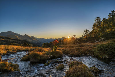 Scenic view of mountains against sky during sunset