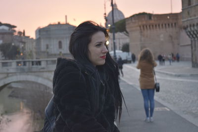 Woman standing in a city