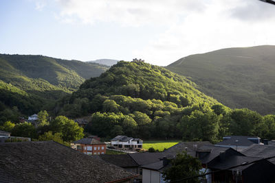 High angle view of townscape and mountains against sky
