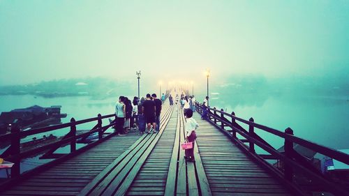 People on stairs leading to jetty