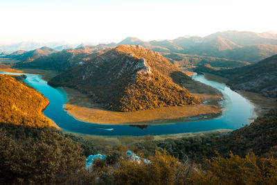 Panoramic view of lake and mountains against sky