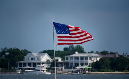 Flag on built structure against sky