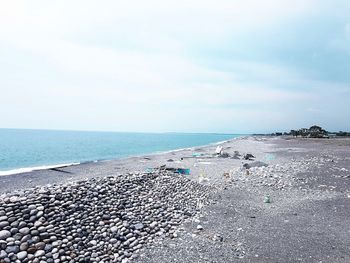 Scenic view of beach against sky