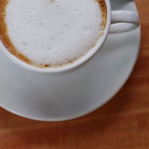 Close-up of cappuccino on table