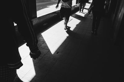 Low section of people walking in city