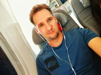 Portrait of young man using mobile phone