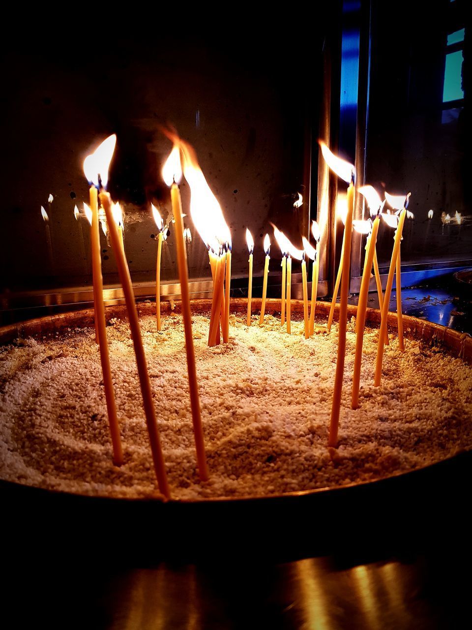 CLOSE-UP OF CANDLES ON WOODEN STRUCTURE