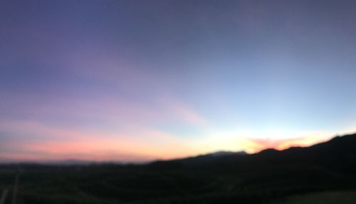 Scenic view of silhouette landscape against sky during sunset