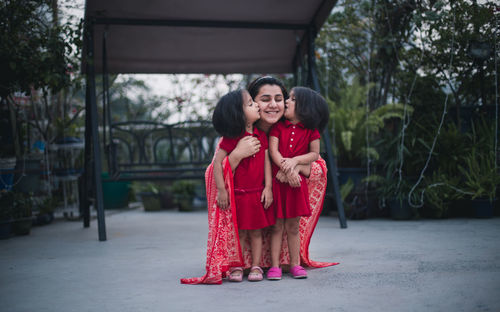 Happy siblings in traditional clothing