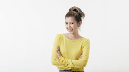 Portrait of a smiling girl over white background