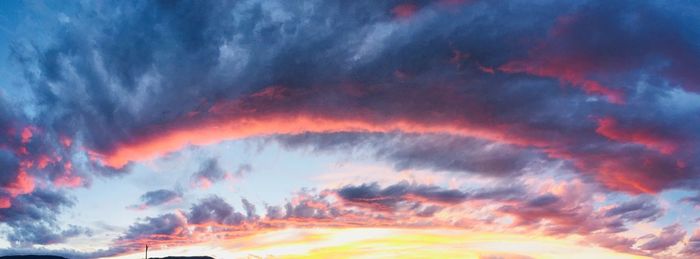 Low angle view of dramatic sky at sunset