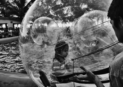 Close-up of girl with bubbles in water