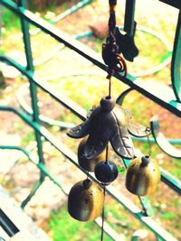 Low angle view of decoration hanging on metal