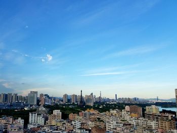 Cityscape against blue sky