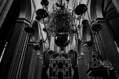 Low angle view of illuminated chandelier hanging in building