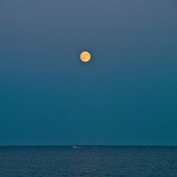 Scenic view of sea against blue sky