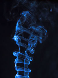 Close-up of smoke against black background