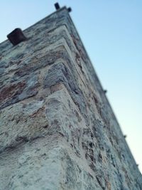 Low angle view of old building against clear sky