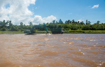 Scenic view of river against sky