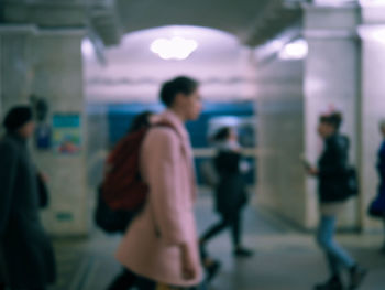 Group of people walking in corridor