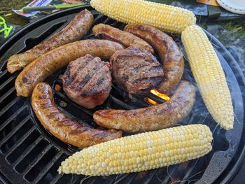 High angle view of meat on barbecue