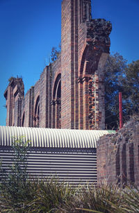 Exterior of historic building against clear blue sky