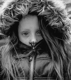 Close-up portrait of girl wearing warm clothing during winter