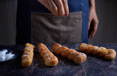 Midsection of person preparing food