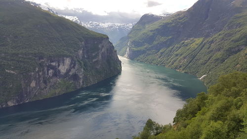 Scenic view of geirangerfjord amidst mountains