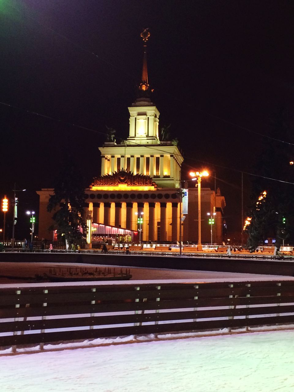 illuminated, architecture, night, building exterior, built structure, tower, city, outdoors, sky, tall - high, tall, history, spire, city life, footpath, no people