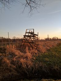 Lifeguard hut on field against clear sky