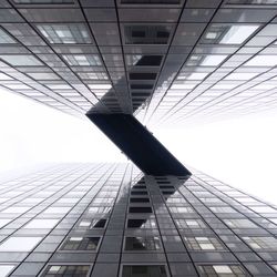 Low angle view of building against cloudy sky