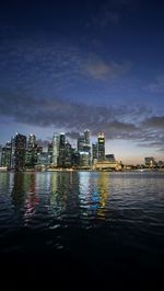 City lit up at waterfront