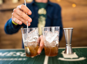 Bartender makes an alcoholic cocktail