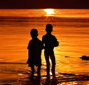 Silhouette of people on beach