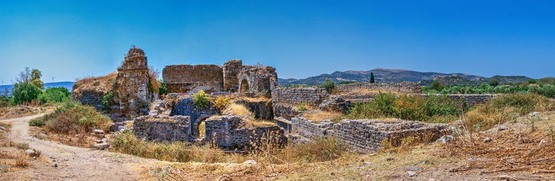 Old ruins against clear blue sky