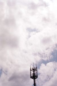 Low angle view of communications tower against sky