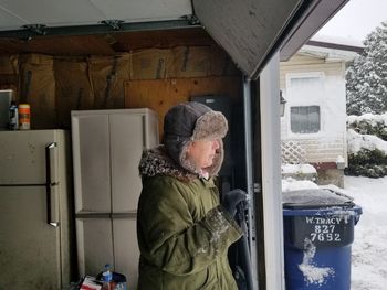 Man standing in front of house