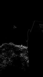 Low angle view of illuminated building against sky at night