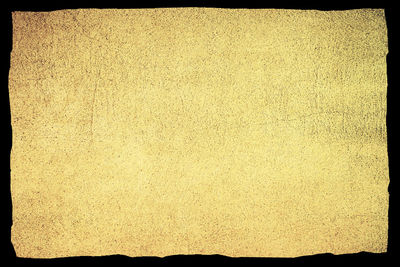 Scenic view of paper against black background