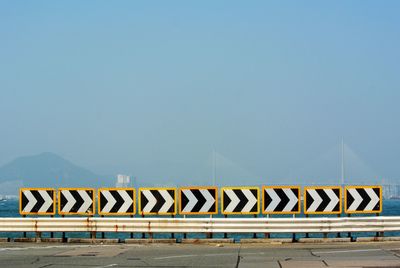 Text on road against sky