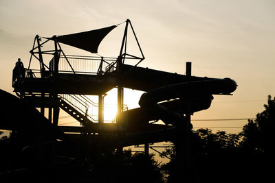 Silhouette of built structure against sky