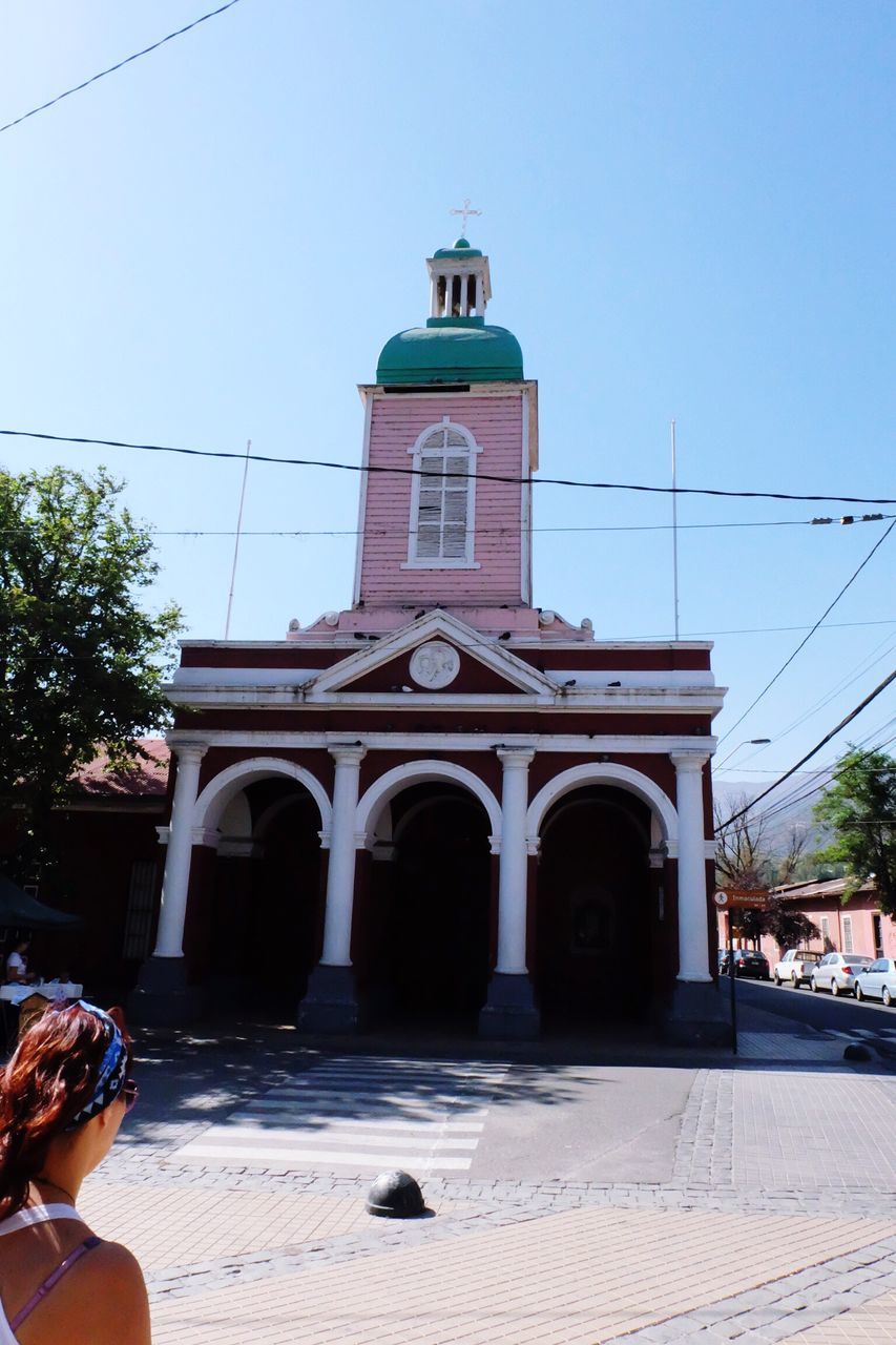 architecture, building exterior, built structure, clear sky, place of worship, religion, spirituality, men, church, sunlight, arch, lifestyles, blue, low angle view, sky, day