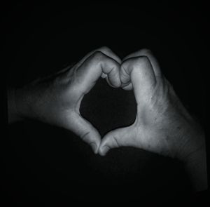 Close-up of man over black background