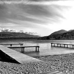 Pier over lake against sky