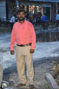 Portrait of young man standing outdoors