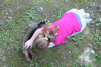 High angle view of dog sleeping on grass