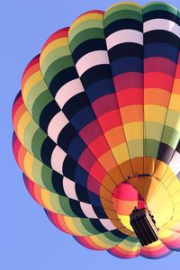 Low angle view of hot air balloons against sky in flight