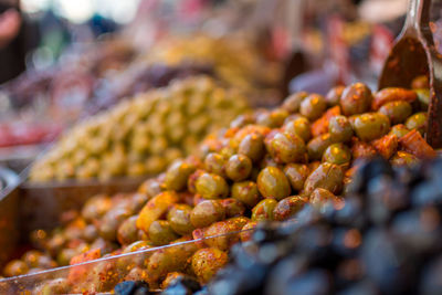 Close-up of olives for sale at market stall