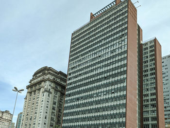 Low angle view of modern buildings against sky